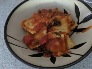 beef ravioli with spinach, onions, and mushrooms in marinara